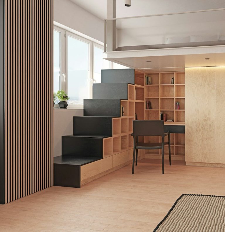 Escalier moderne en bois et noir, bureau en coin, lumière naturelle.